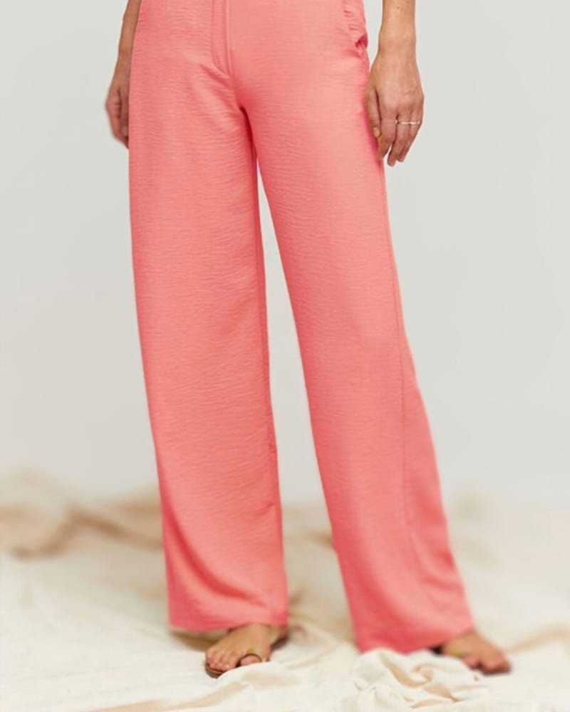 Front of a model wearing a size Large Ozo Trouser in Coral in Coral by Aldo Martins. | dia_product_style_image_id:345901